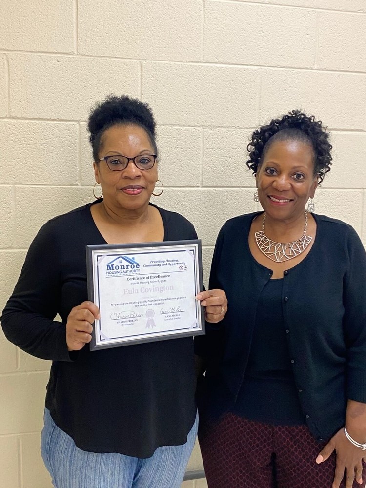 Eula Covington with certificate of excellence
