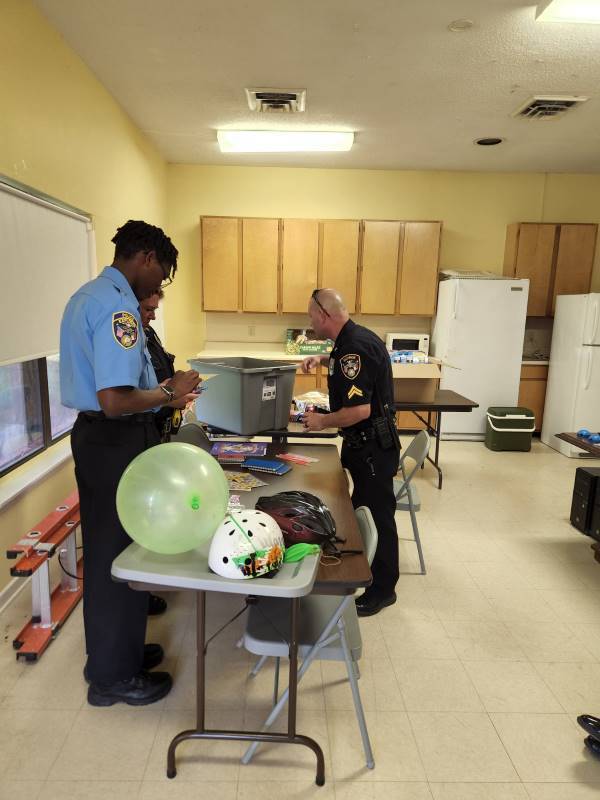 Police officers sorting prizes out.