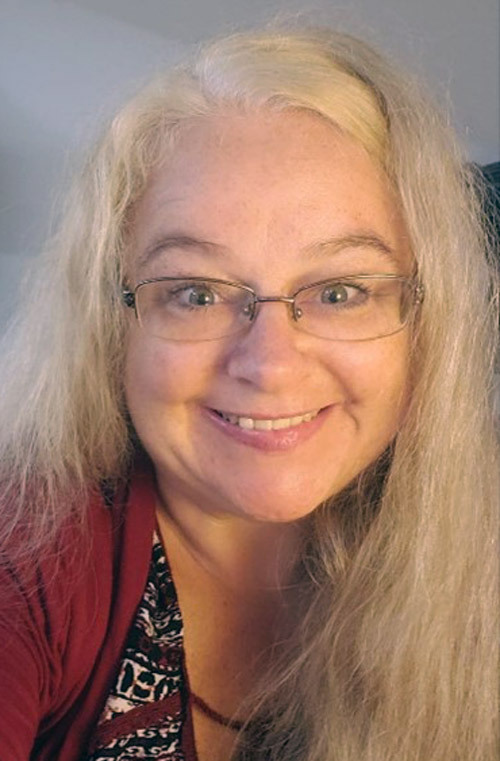 Monica Davis smiles at the camera. 