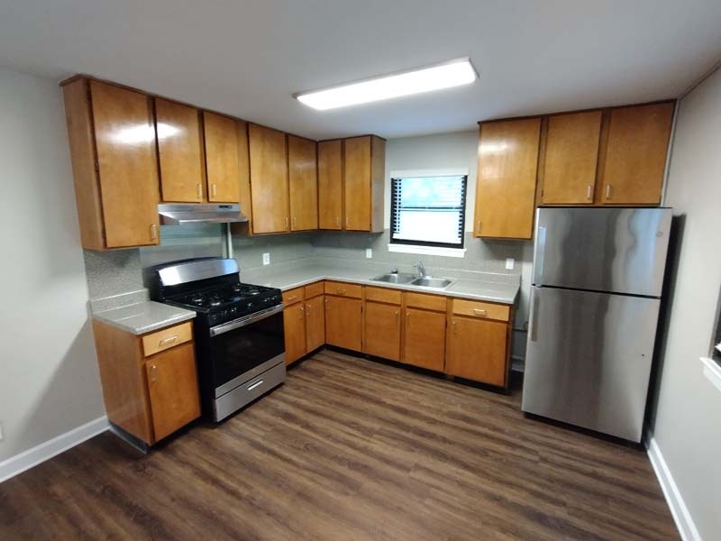 1200 Kitchen after renovations. New floors, updated appliances, and new light fixtures. 