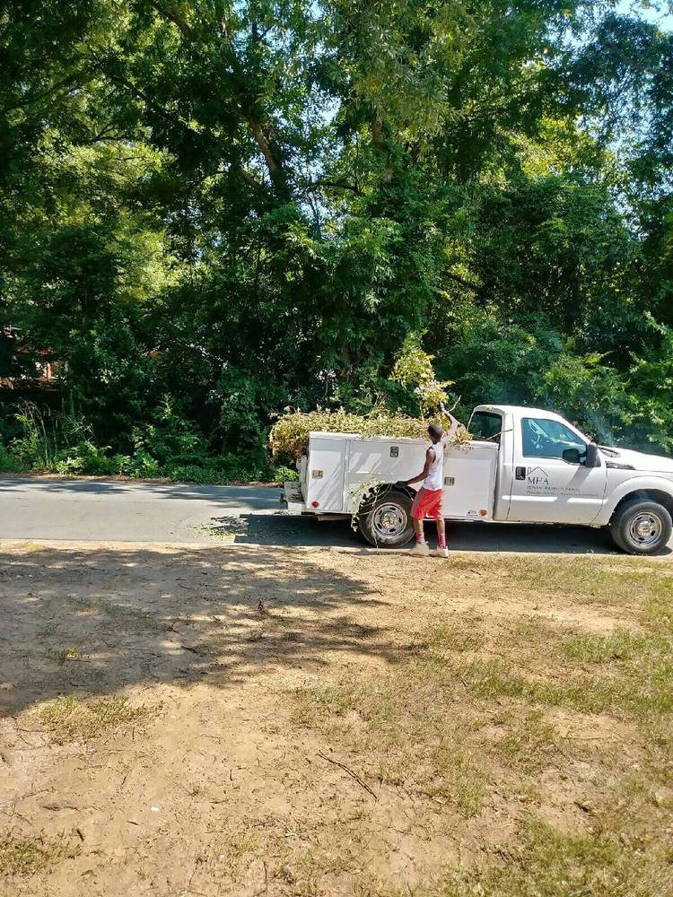 resident youth working with truck