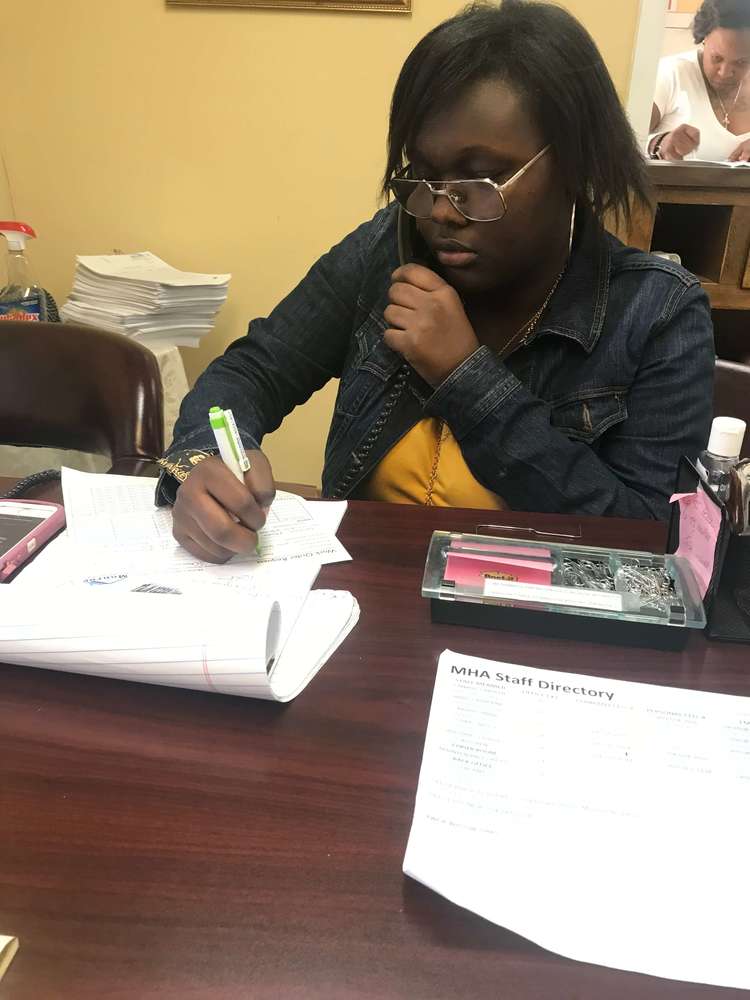 resident youth girl doing paperwork