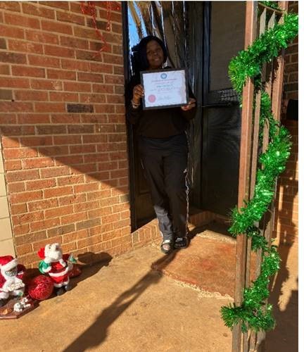 Ms. Bobbie Bailey with decorated door