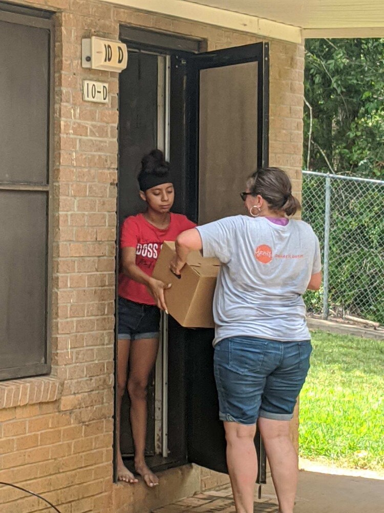 Handing over box of goods