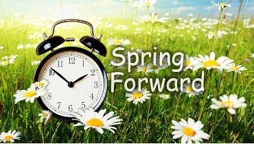 Spring Forward, a clock and a field of flowers in the distance.